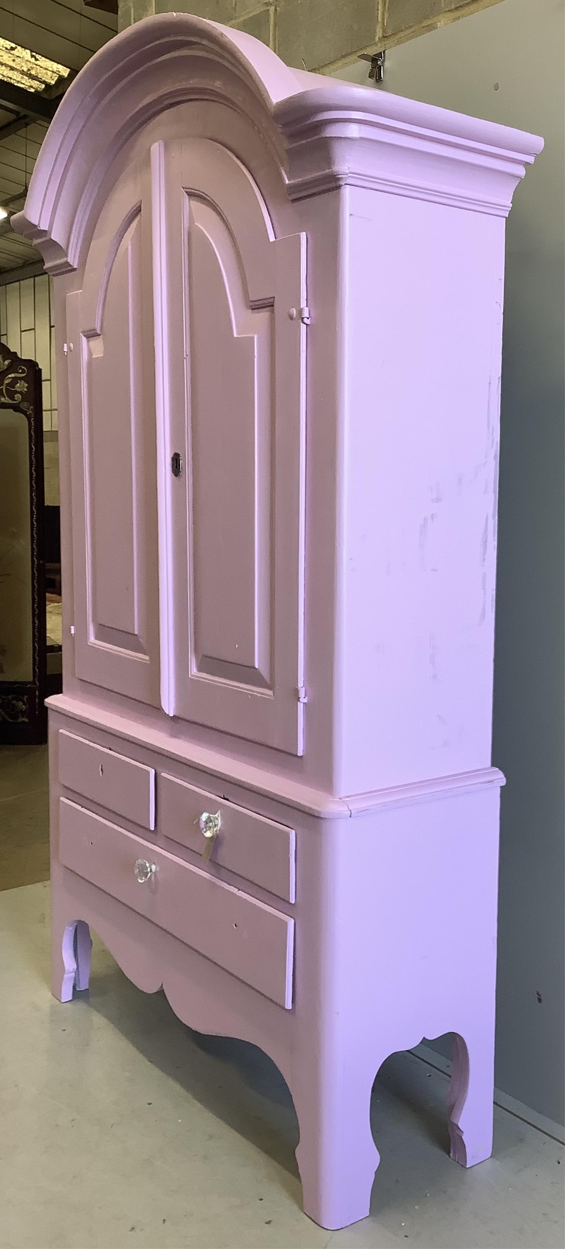 An early 19th century Continental pine armoire, later painted pink, width 136cm, depth 48cm, height 224cm. Condition - fair